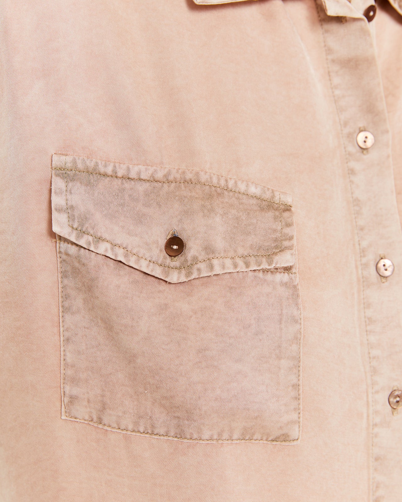 Shirt with worn-effect pockets