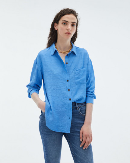 Blue flowing shirt with...