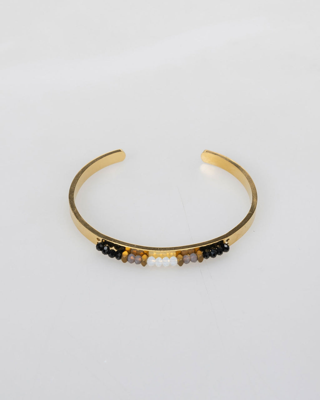 Semi-open rigid bracelet with rhinestone detail in the center