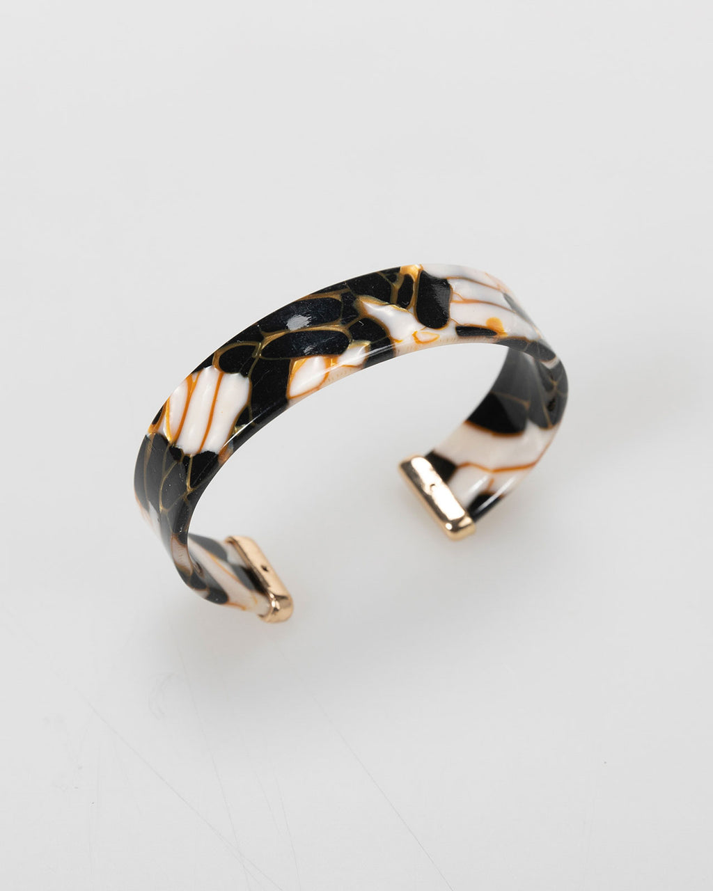 Semi-open rigid bracelet with marble effect