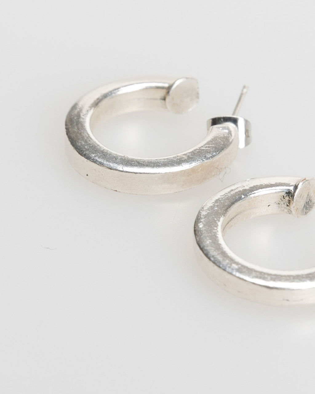 Plain silver-colored hoop earrings