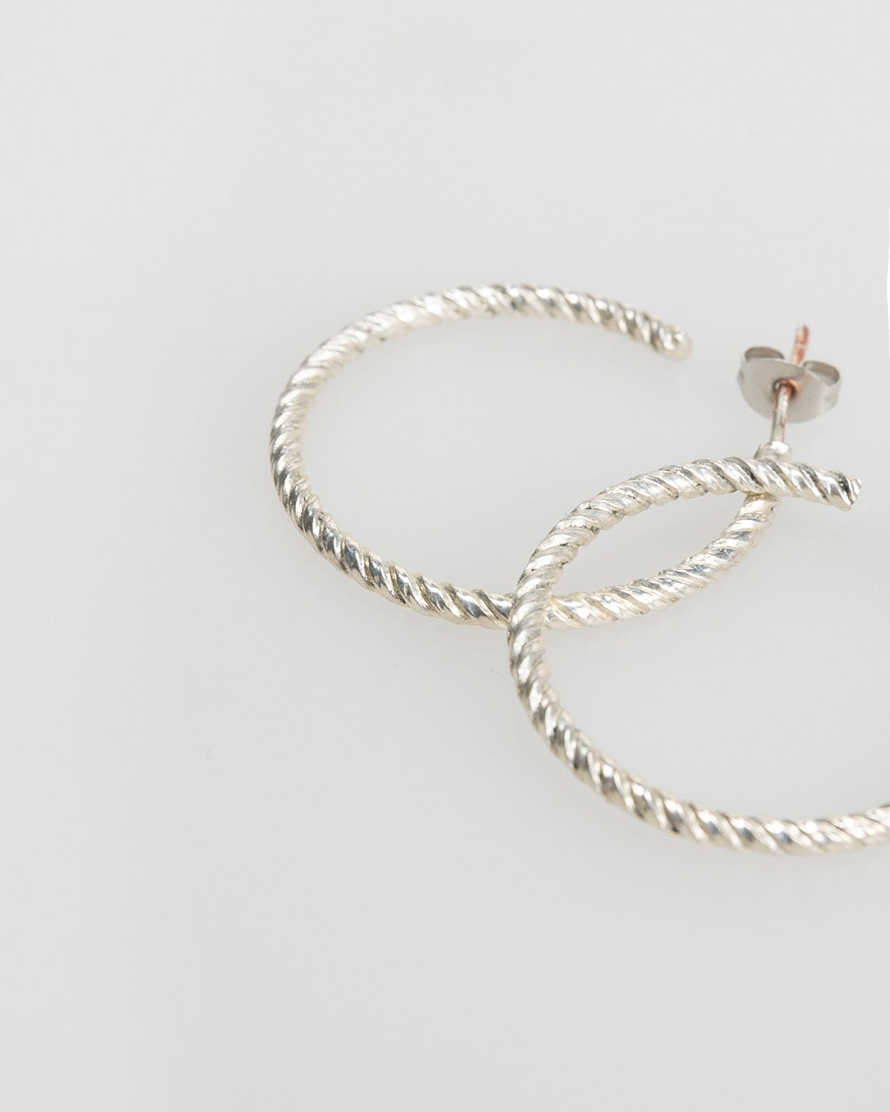 Silver-coloured embossed hoop earrings