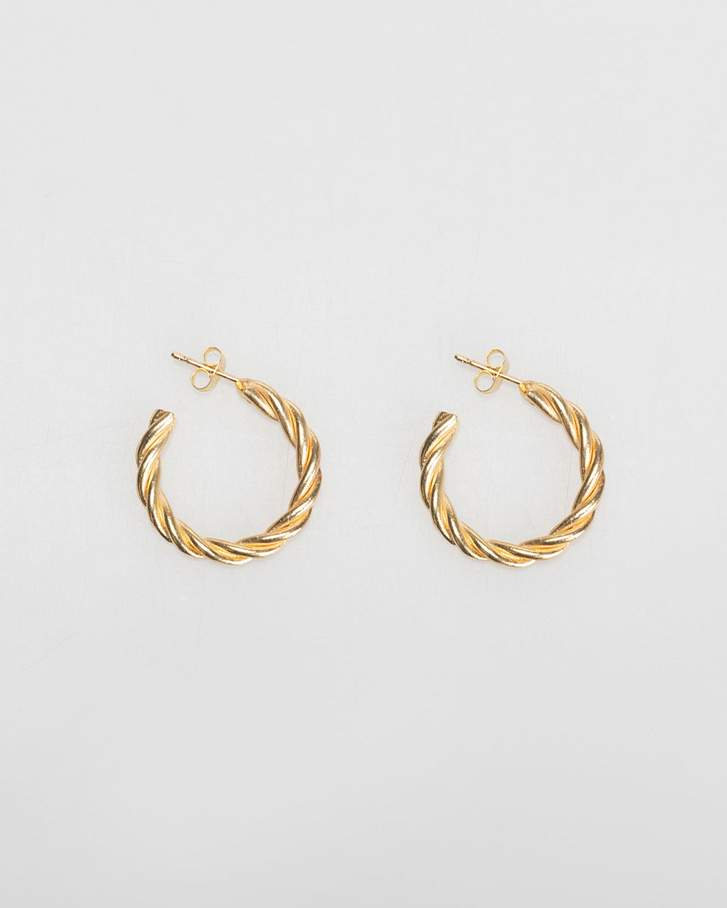 Gold relief hoop earrings with nut closure