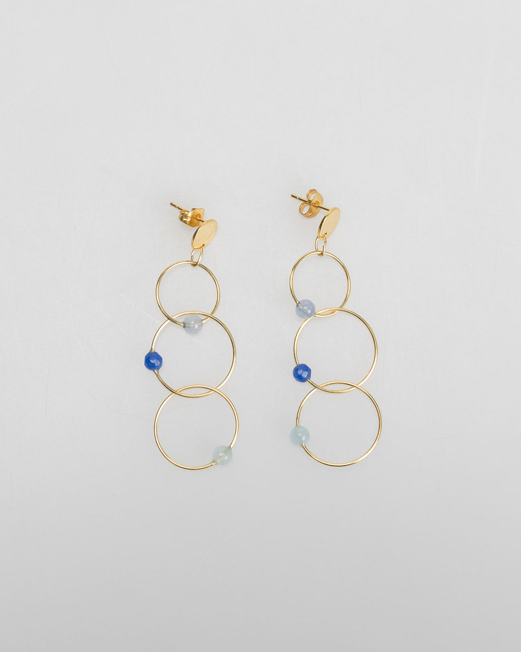 Three gold hoop earrings with rhinestone detail