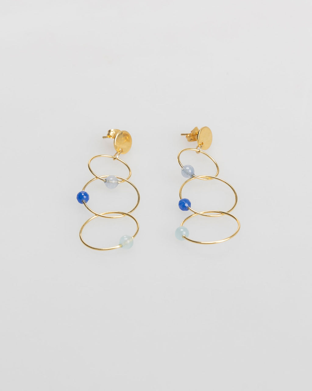 Three gold hoop earrings with rhinestone detail