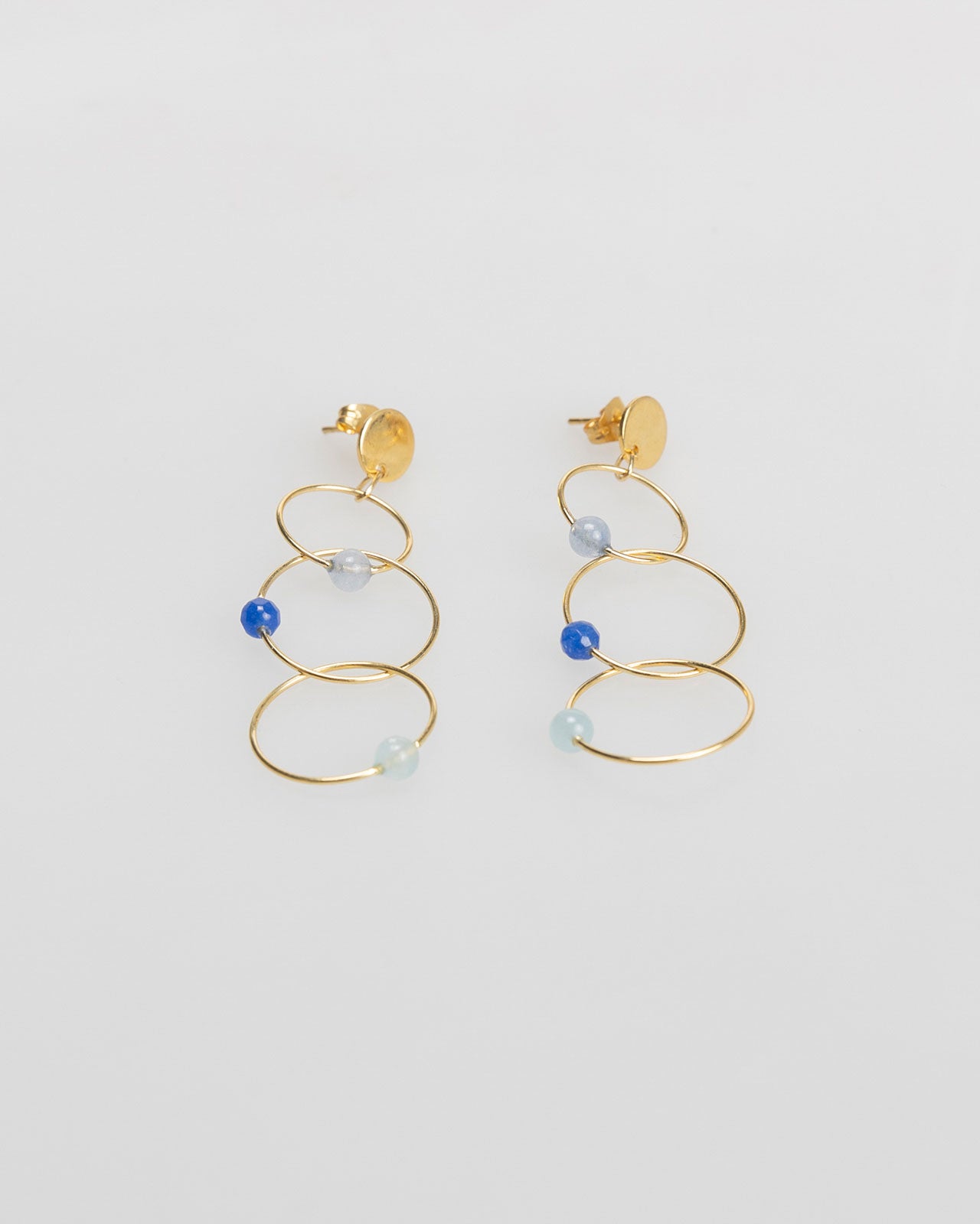 Three gold hoop earrings with rhinestone detail