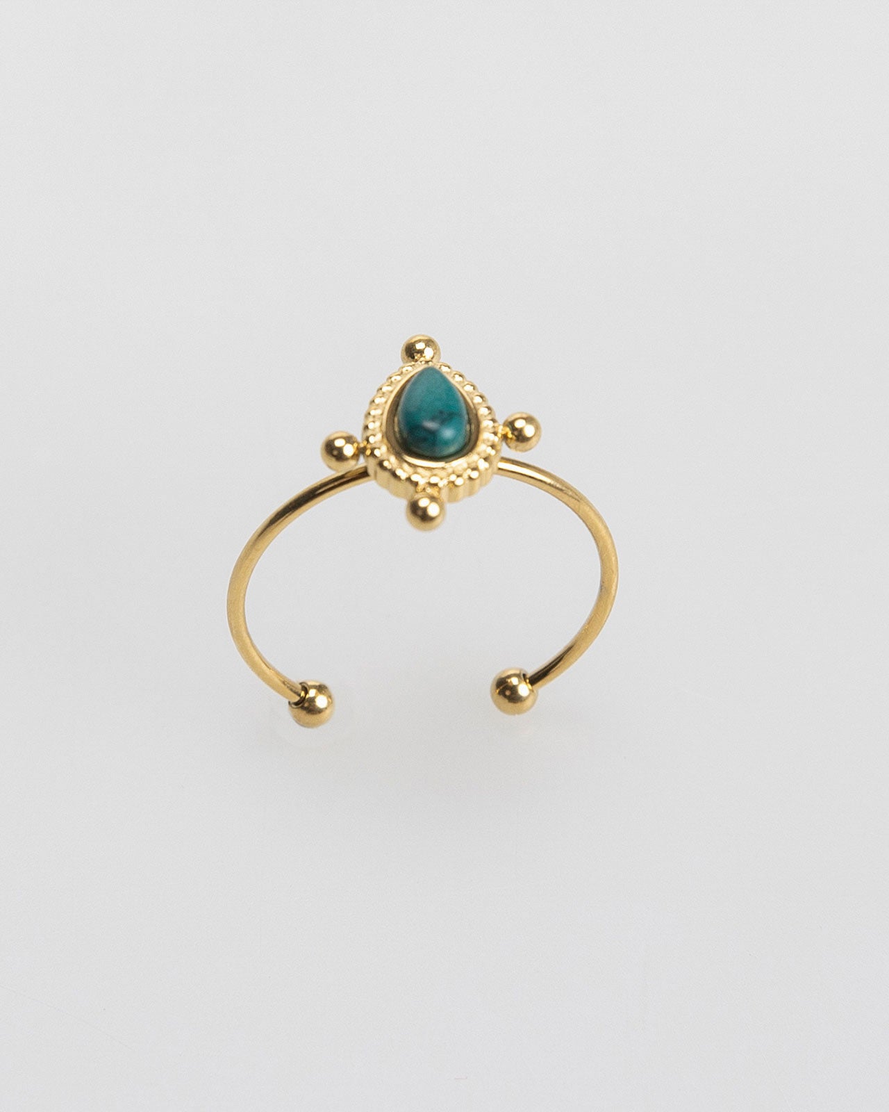 Thin gold-colored ring with colored stone