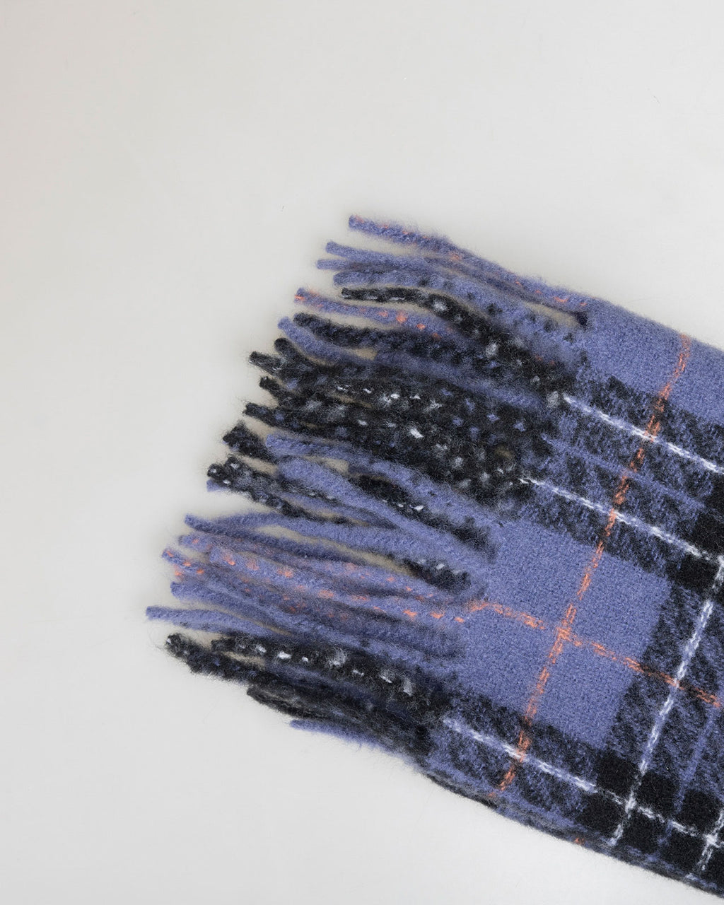 Blue checked scarf finished with fringes