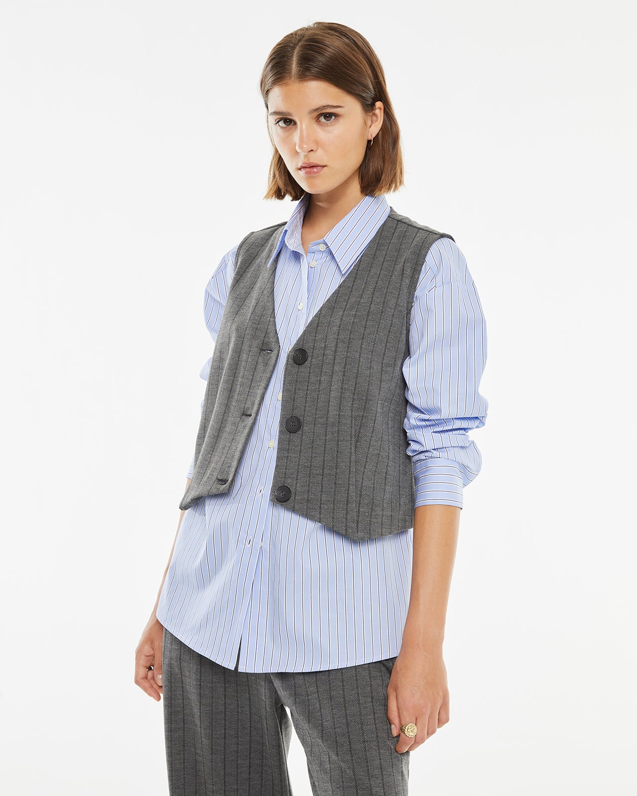 Pinstripe vest with hidden button closure on the front