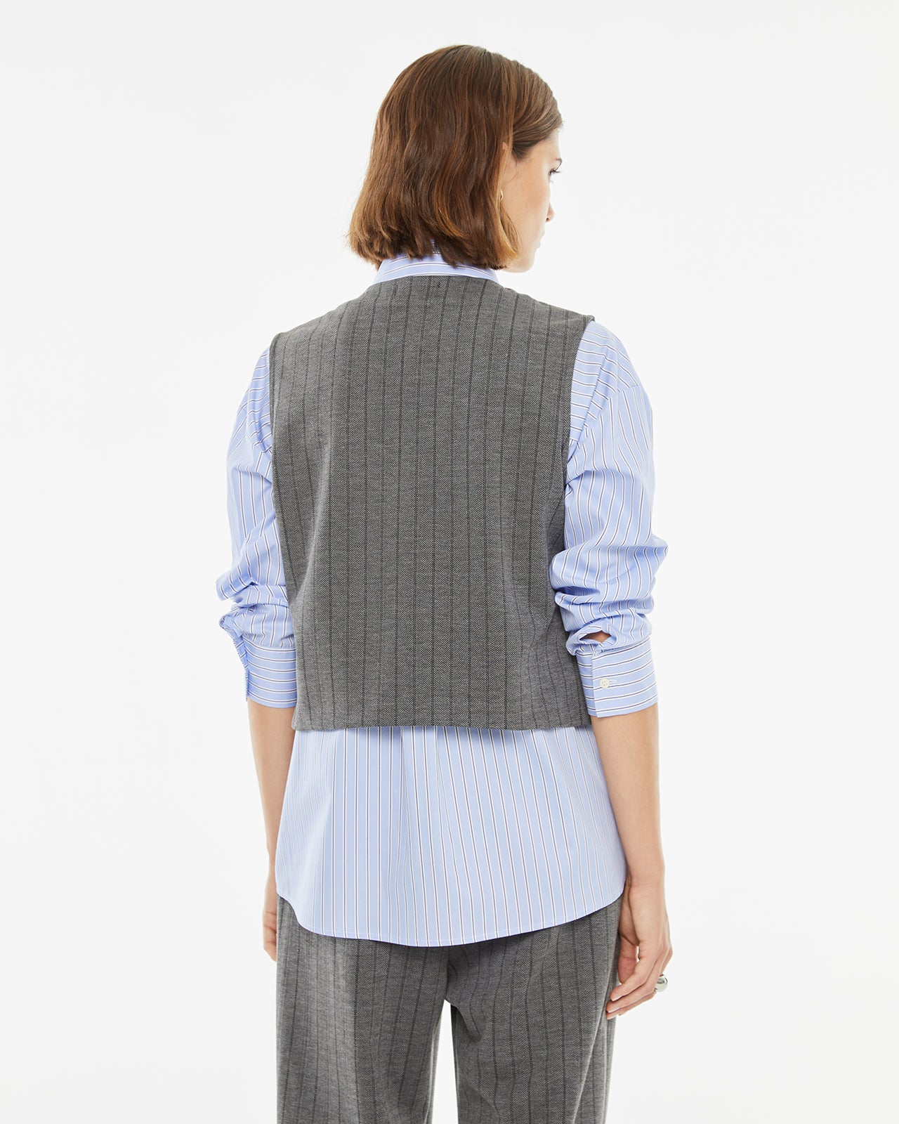 Pinstripe vest with hidden button closure on the front