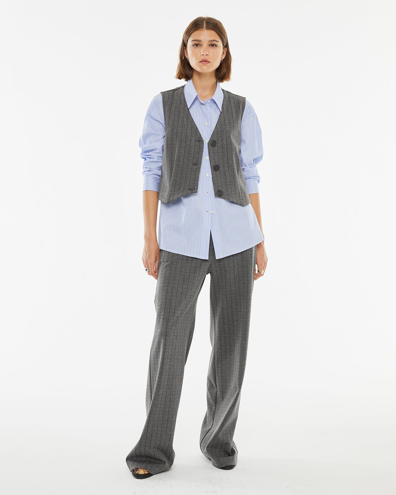 Pinstripe vest with hidden button closure on the front