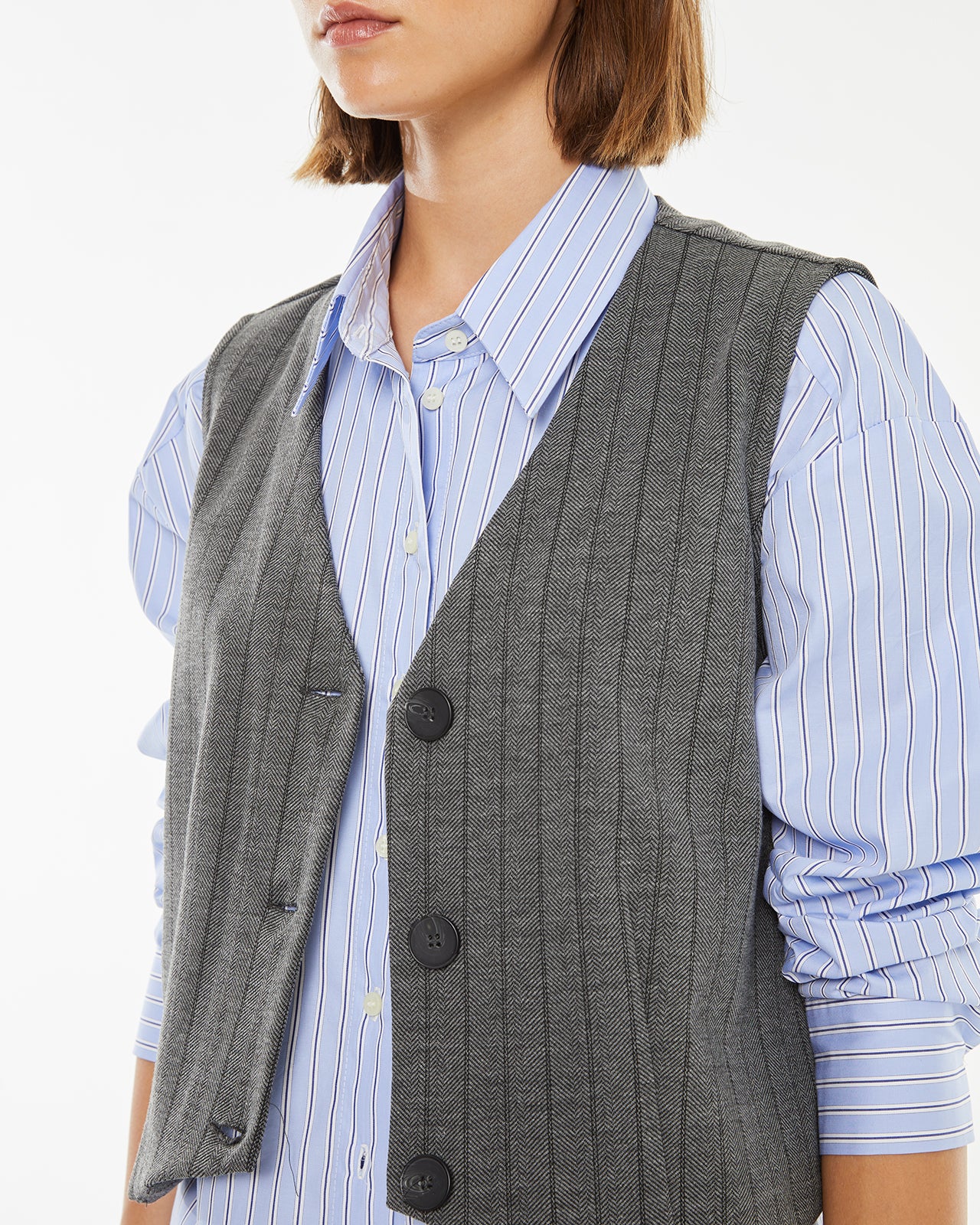 Pinstripe vest with hidden button closure on the front