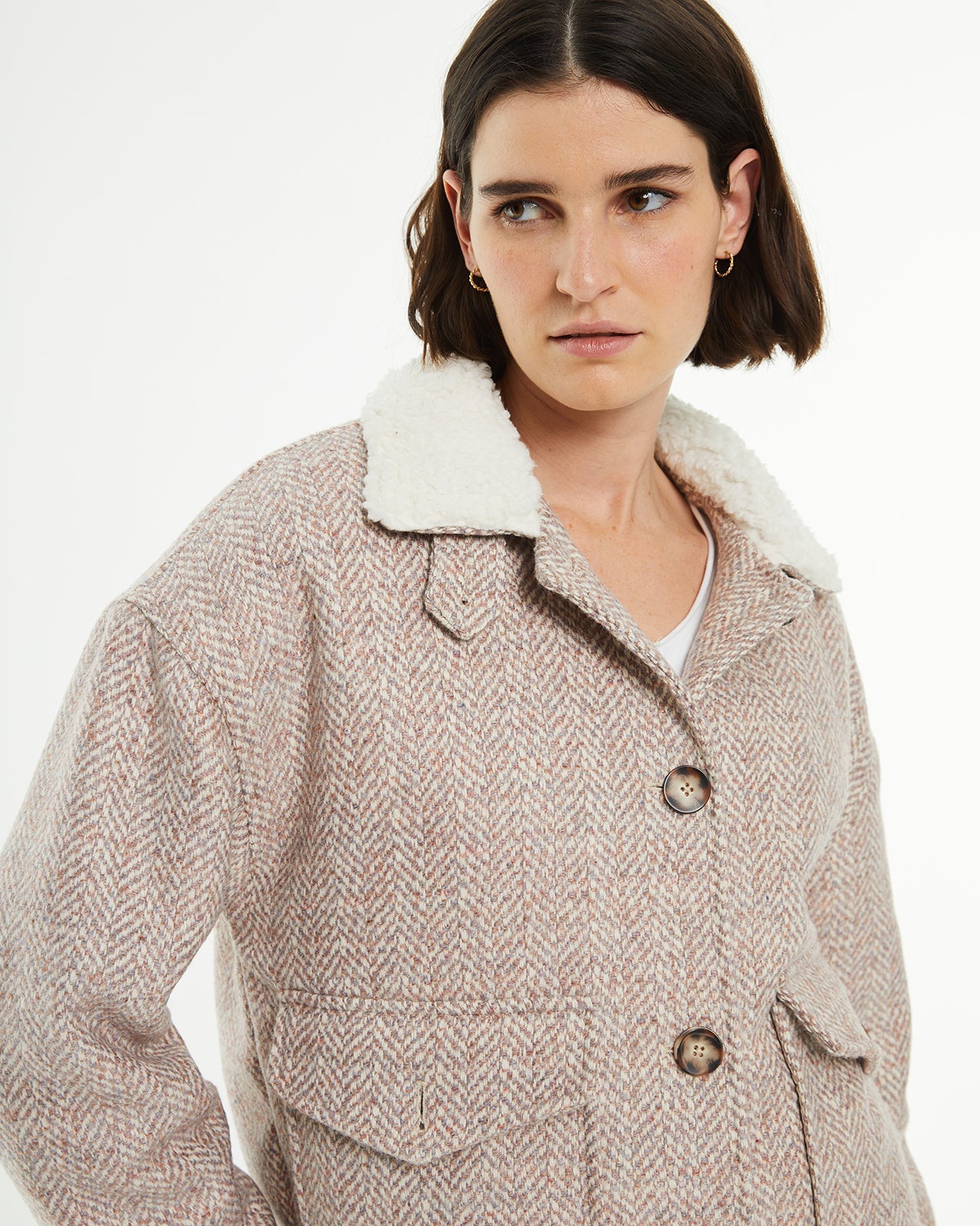 Short jacket with button closure and sheepskin lining