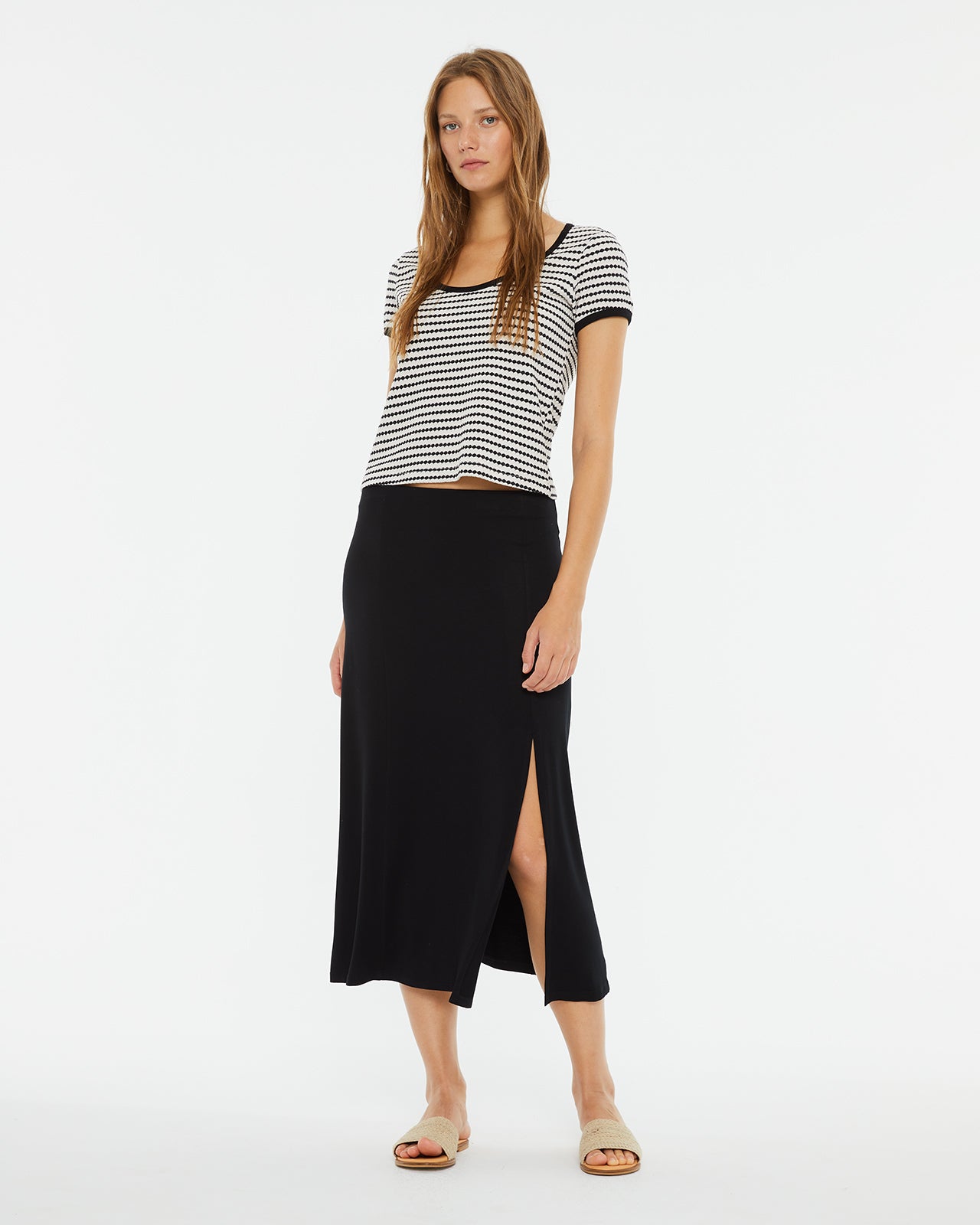 Midi skirt with slit and flared hem