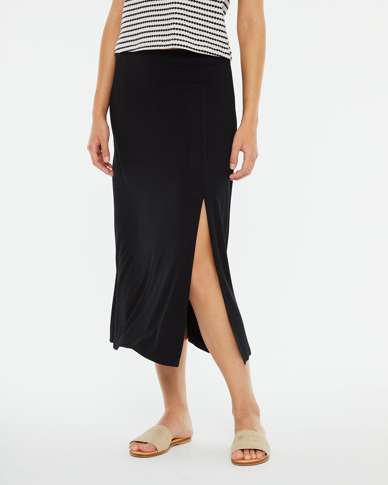 Midi skirt with slit and flared hem