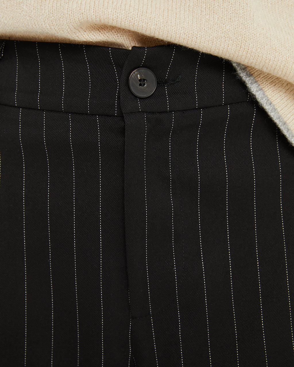 Long pinstripe trousers with belt loops at the waist