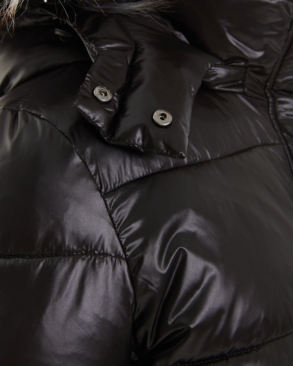 Plumón capucha pelo