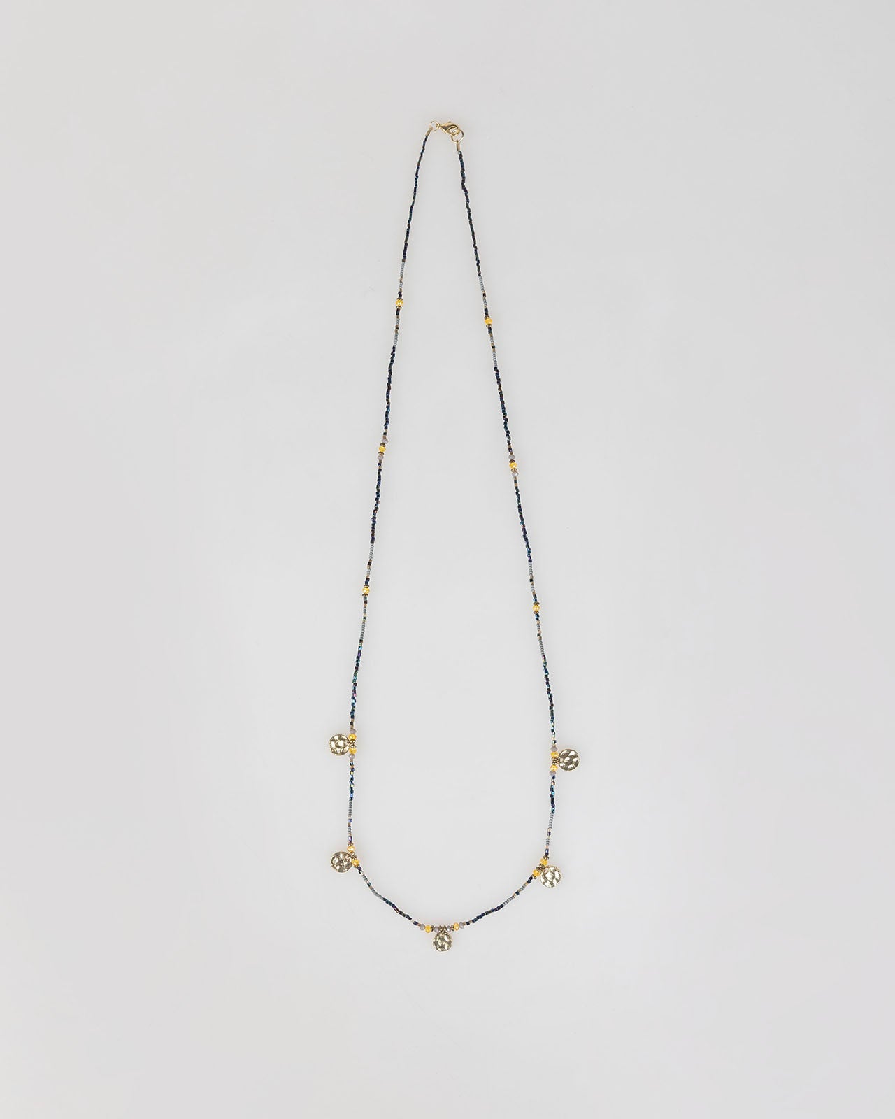 Long necklace with golden beads