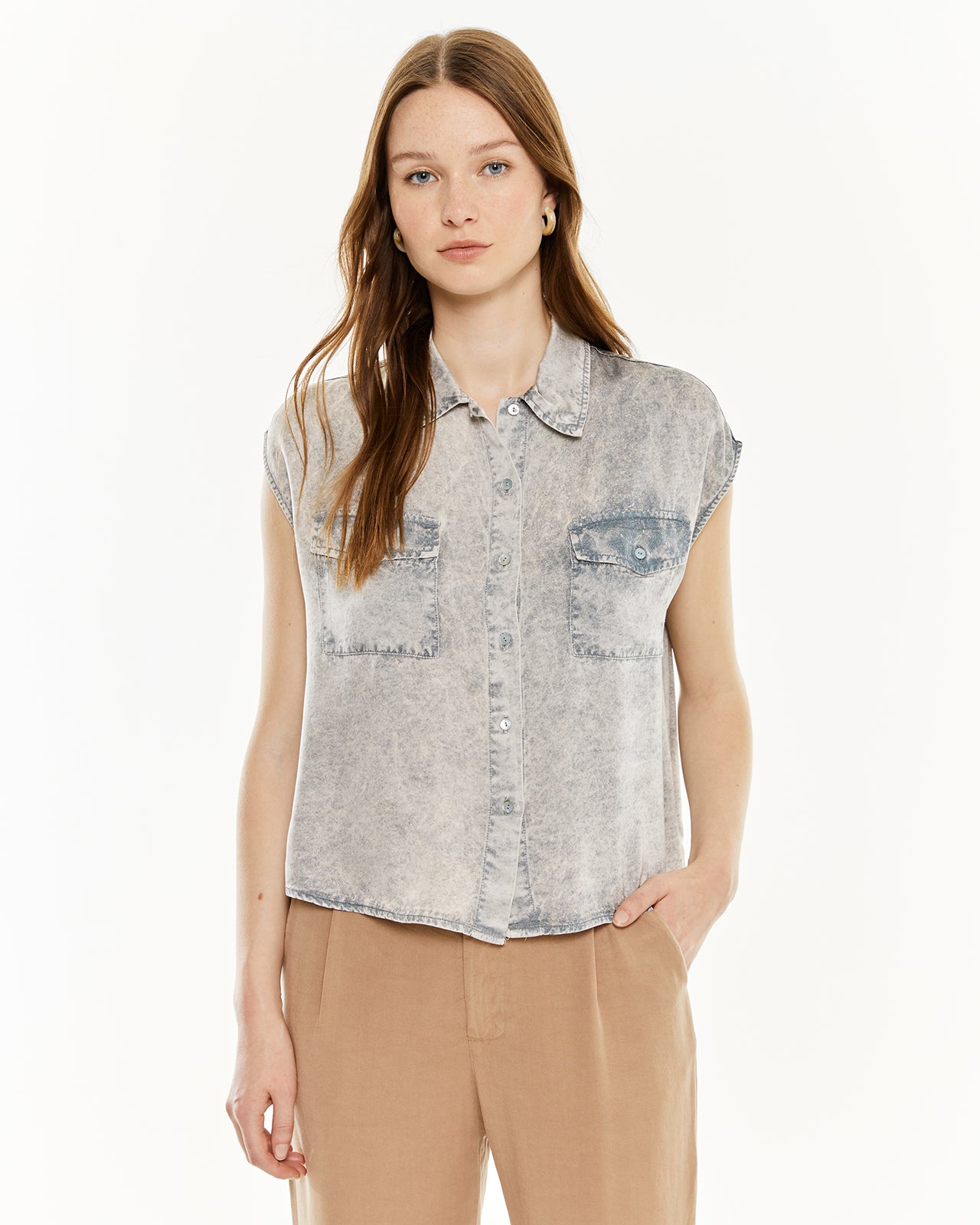 Shirt with worn effect pockets