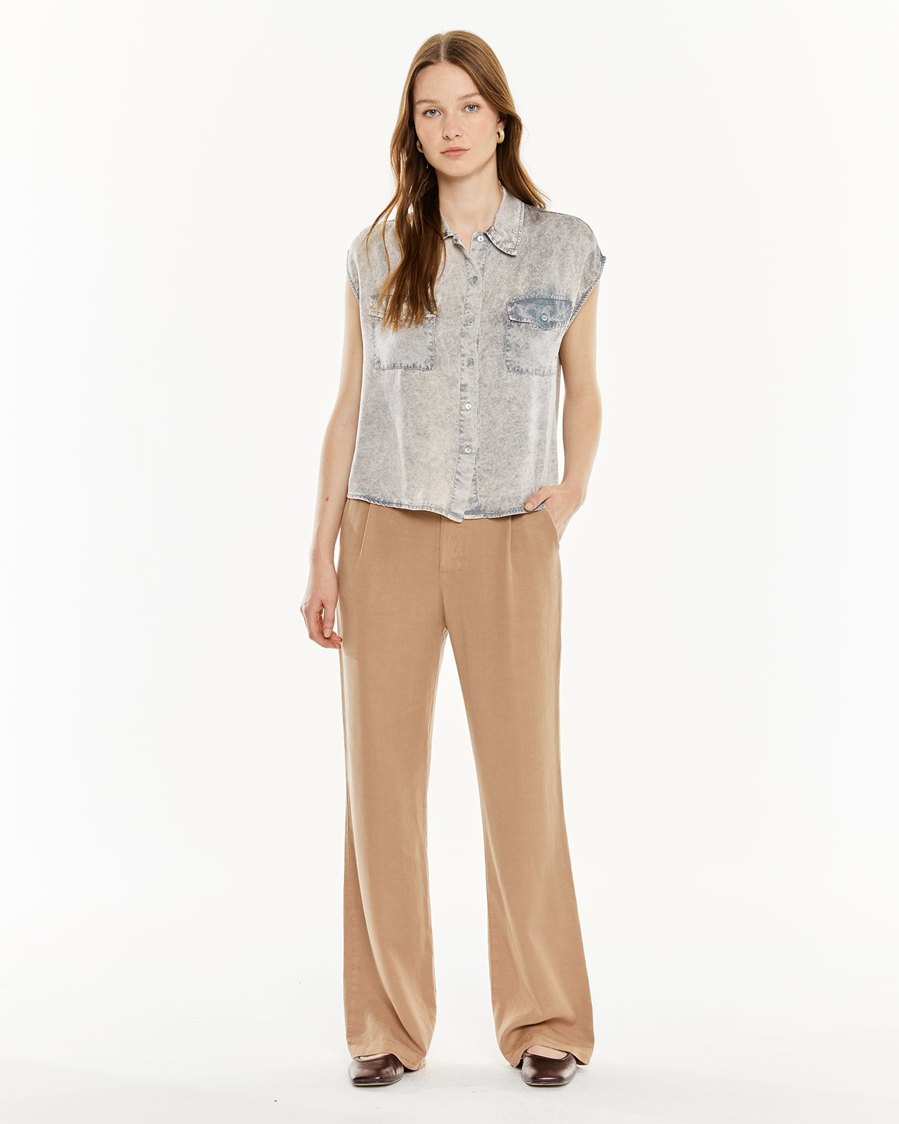 Shirt with worn effect pockets