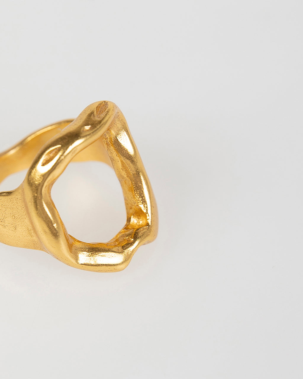 Open gold ring with seal