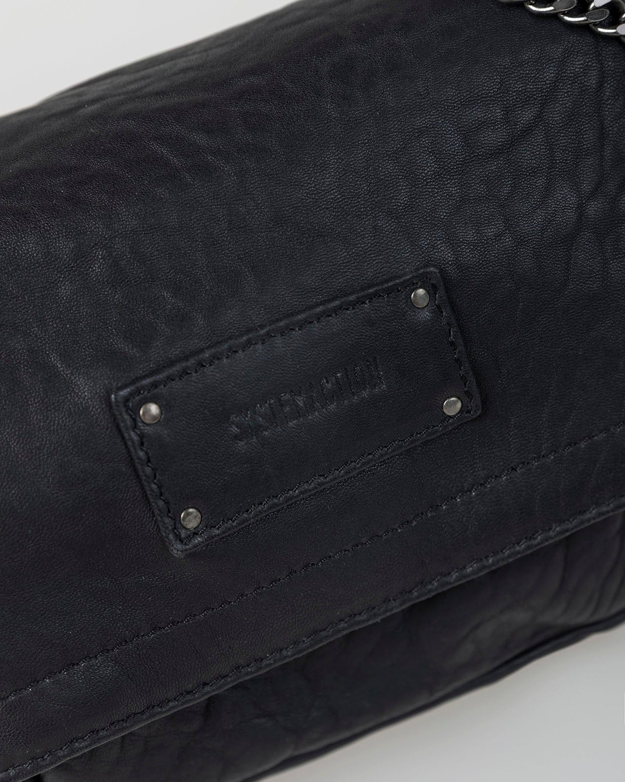 Bolso piel tachas