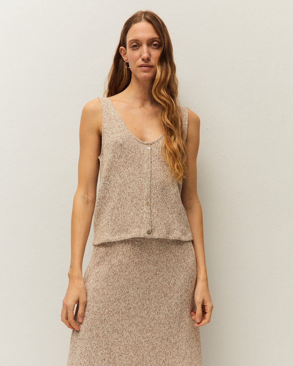 Sleeveless button-down top