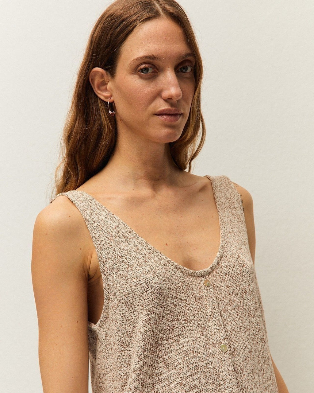 Sleeveless button-down top