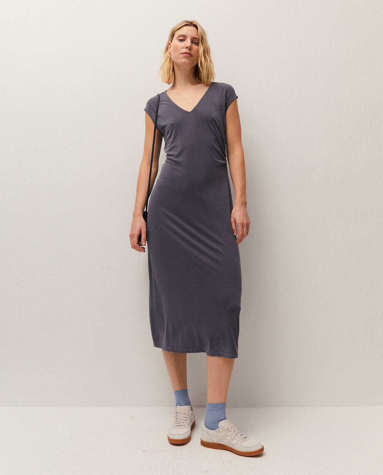 V-neck midi dress. Gathered detail at the waist