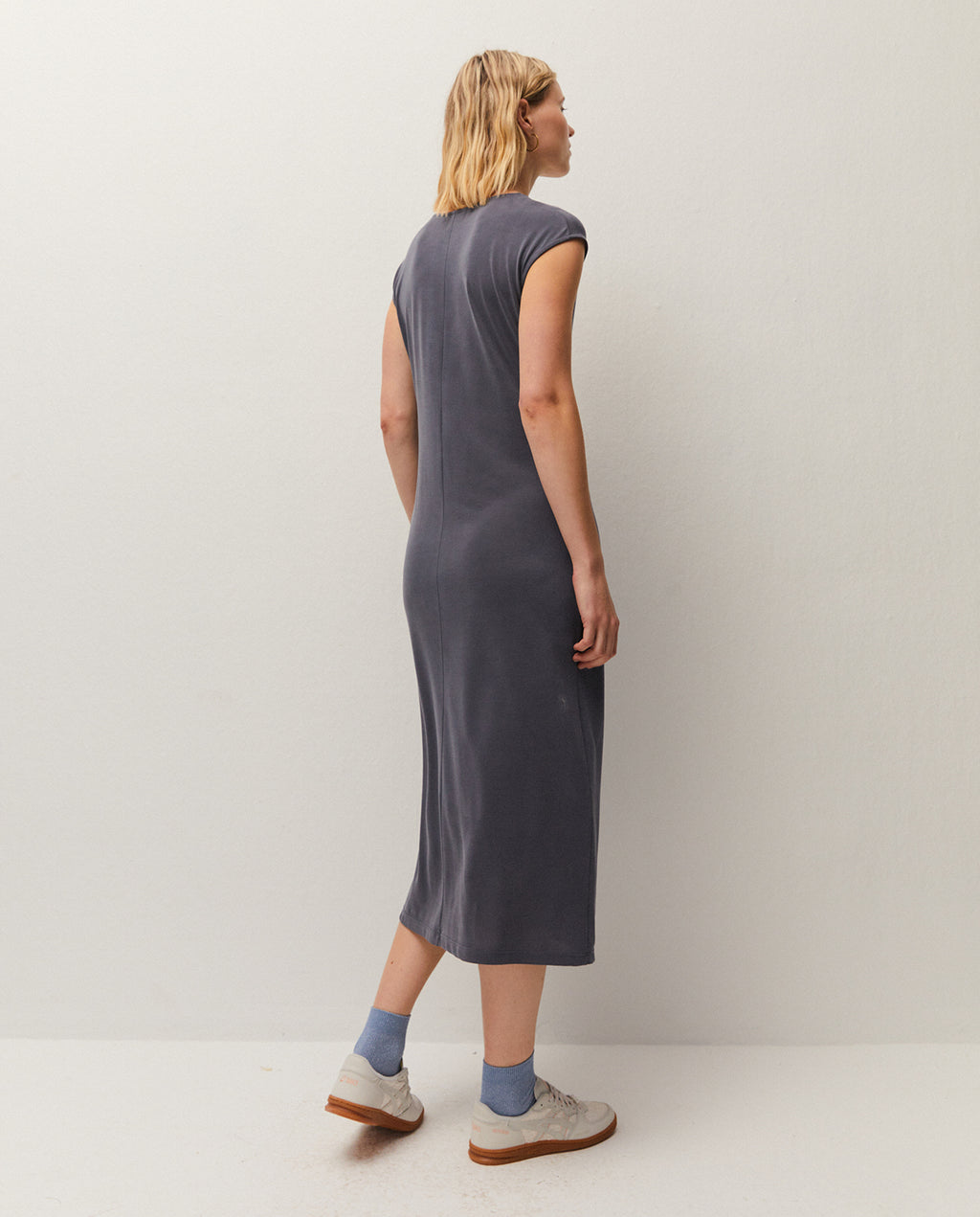 V-neck midi dress. Gathered detail at the waist