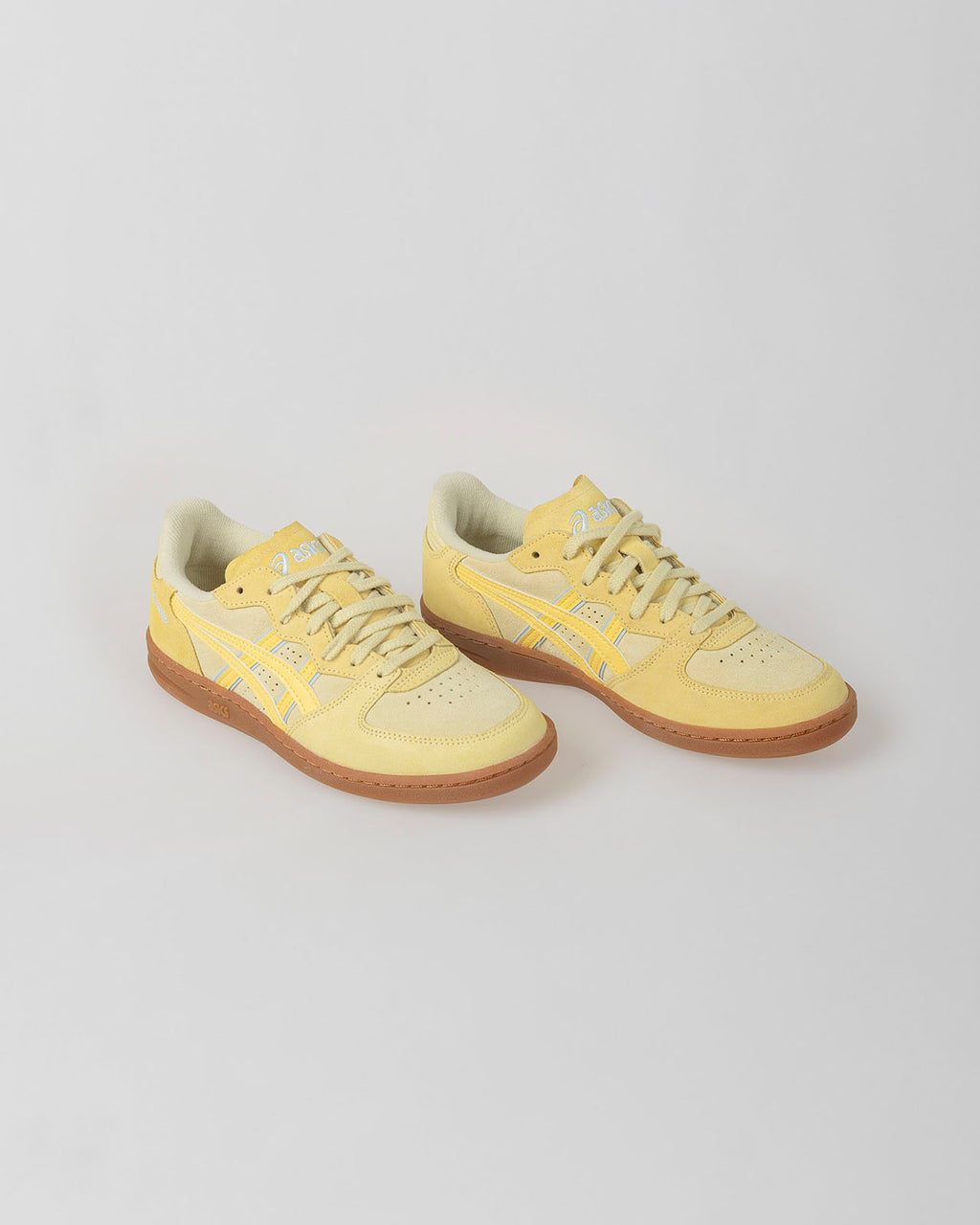 Yellow Asics Skyhand OG shoe