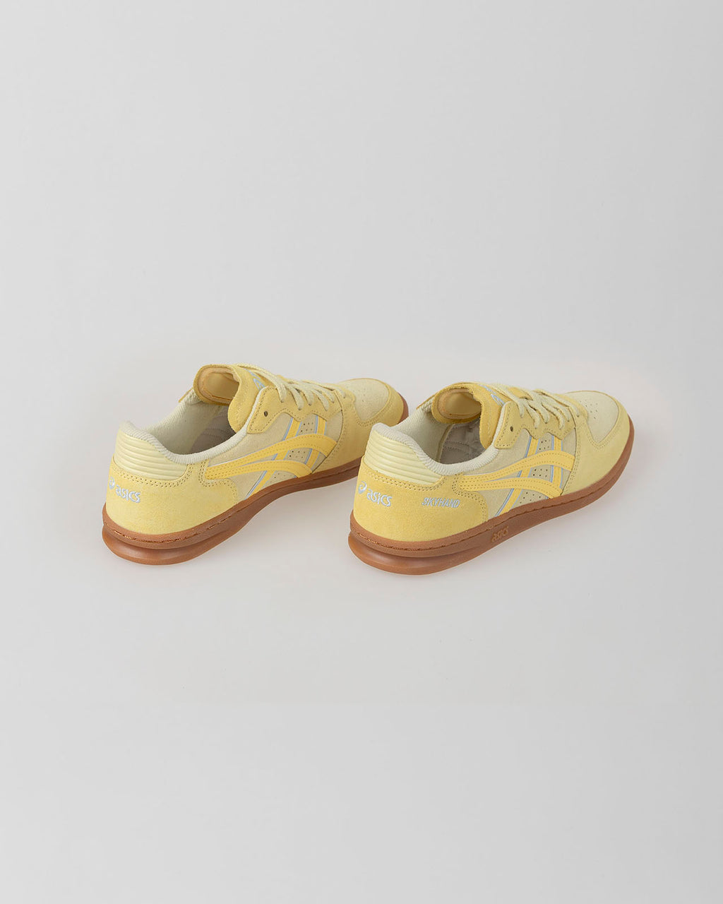 Yellow Asics Skyhand OG shoe