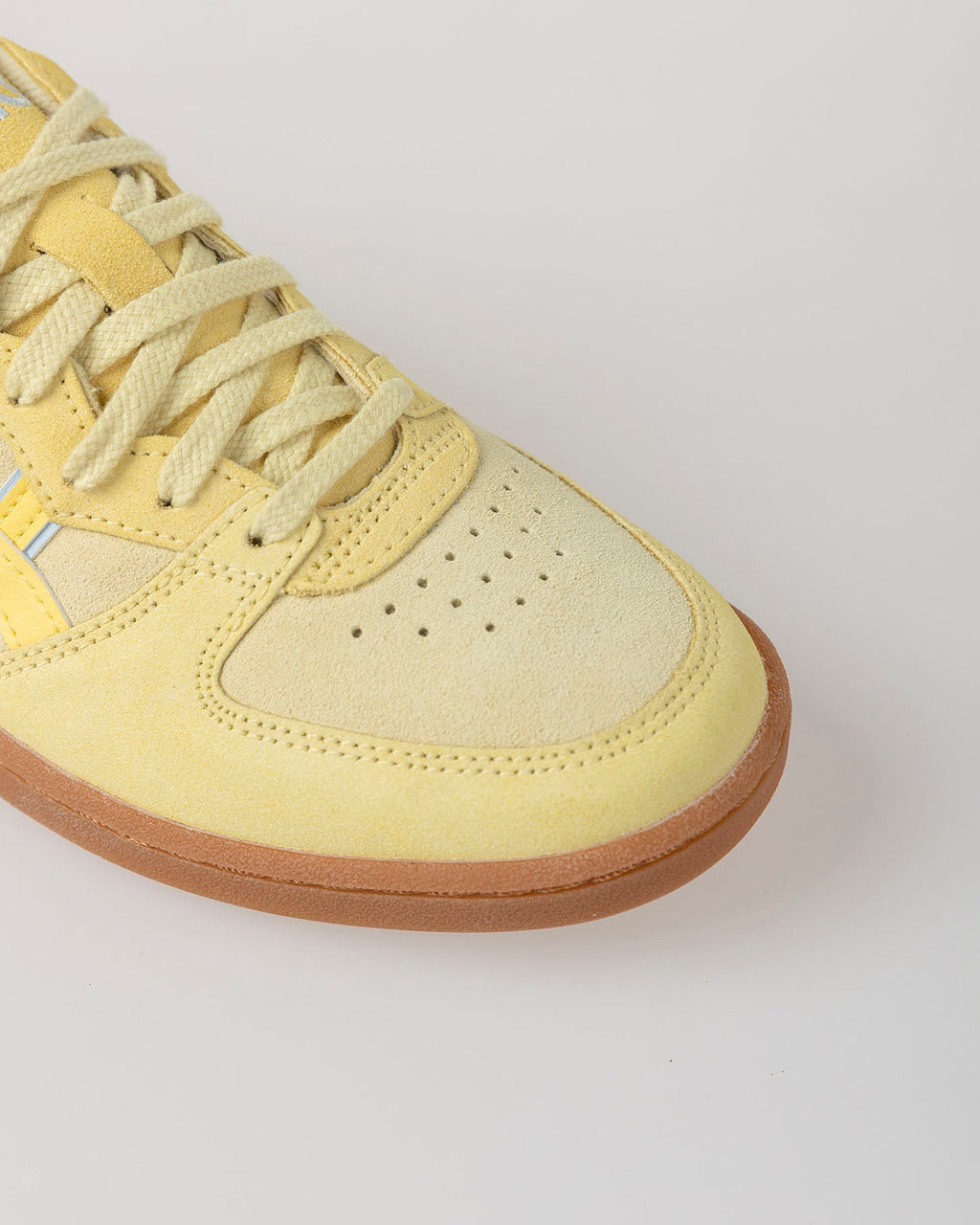 Yellow Asics Skyhand OG shoe