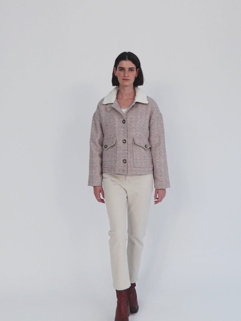 Short jacket with button closure and sheepskin lining