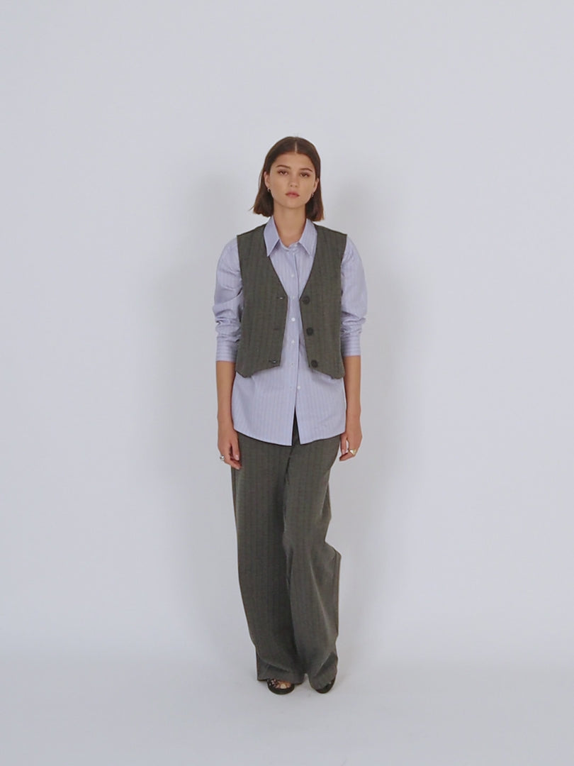 Pinstripe vest with hidden button closure on the front